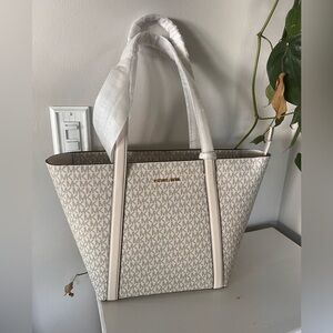 Brand new Michael Kors bag retails for over $498